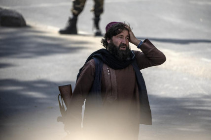 A shocked Taliban fighter stands guard at the explosion site, near a mosque, in Kabul, Afghanistan, Friday, Sept 23, 2022. An explosion went off near a mosque in Afghanistan's capital on Friday, with police confirming casualties. (AP/RSS Photo)
