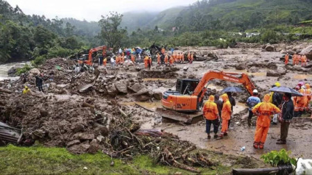 This photograph provided by the National Disaster Response Force (NDRF) shows rescuers at a spot after a landslide in Wayanad, southern Kerala state, India, Tuesday, July 30, 2024. (AP)