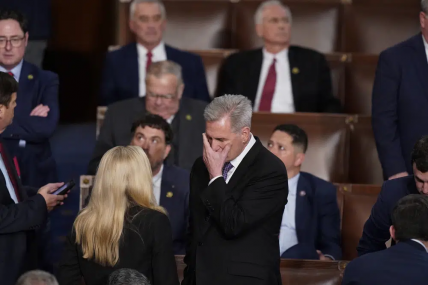 Rep. Kevin McCarthy, R-Calif., talks with Rep. Marjorie Taylor Greene, R-Ga., at the beginning of an evening session after six failed votes to elect a speaker and convene the 118th Congress in Washington, Wednesday, Jan. 4, 2023.  AP/RSS Photo