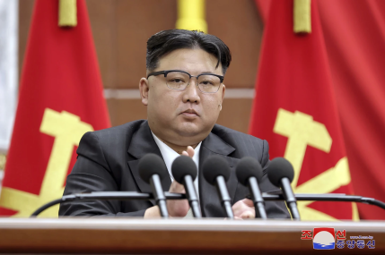 In this photo provided by the North Korean government, North Korean leader Kim Jong Un delivers a speech during a year-end plenary meeting of the ruling Workers’ Party, which was held between Dec. 26, and Dec. 30, 2023, in Pyongyang, North Korea.