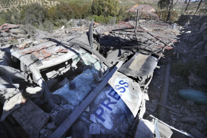 Destroyed vehicles used by journalists at the site where an Israeli airstrike hit a compound housing journalists, killing three media staffers from two different news agencies according to Lebanon’s state-run National News Agency, in Hasbaya village, southeast Lebanon, Friday, Oct. 25, 2024. (AP Photo)