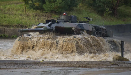 FILE -- A Leopard 2A6 main battle tank drives through a pool of water during preparations for the 'Land Operations 2017' information training exercise in Munster, Germany, Sept 25, 2017. AP/RSS Photo