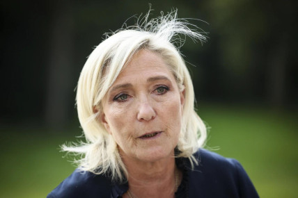 FILE - French far-right leader Marine Le Pen answers reporters at the Elysee Palace after a meeting with French President Emmanuel Macron, Aug. 26, 2024 in Paris. (AP Photo