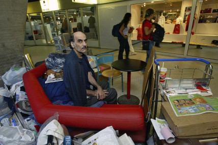 FILE - Merhan Karimi Nasseri sits among his belongings at Terminal 1 of Roissy Charles De Gaulle Airport, north of Paris on Aug 11, 2004. (AP/RSS Photo)