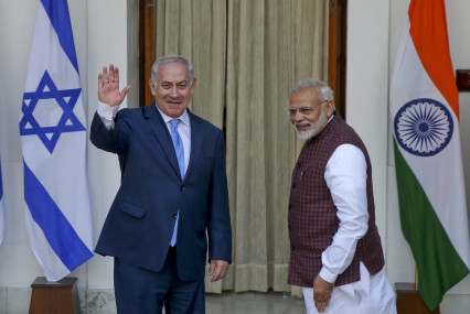 FILE- India's Prime Minister Narendra Modi, right gestures and Israeli Prime Minister Benjamin Netanyahu waves to the media as they arrive for a meeting in New Delhi, India, Jan.15, 2018. (AP/RSS Photo)