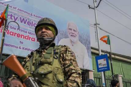 A paramilitary soldier guard near a road barricade set up by security forces ahead of Indian Prime Minister Narendra Modi&#x27;s visit to Srinagar, Indian controlled Kashmir, Wednesday, March 6, 2024. (AP/RSS Photo)