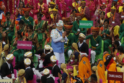 Indian Prime Minister Narendra Modi, center, greets artists performing at the 17th-century Mughal-era Red Fort on Independence Day in New Delhi, India, Monday, Aug.15, 2022. AP/RSS Photo