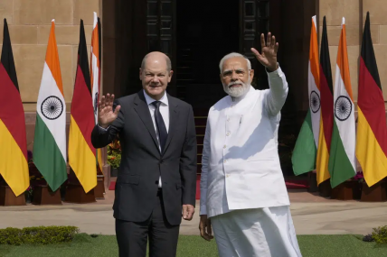 Indian Prime Minister Narendra Modi, right, with German Chancellor Olaf Scholz, wave to media before their meeting in New Delhi, India, Saturday, Feb. 25, 2023. AP/RSS Photo