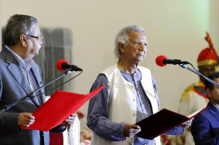 FILE - Bangladesh’s figurehead President Mohammed Shahabuddin administers the oath of office to Nobel laureate Muhammad Yunus, right, as the head of Bangladesh’s interim government, in Dhaka, Bangladesh, on Aug. 8, 2024. (AP Photo)