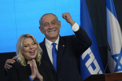 Former Israeli Prime Minister and the head of Likud party, Benjamin Netanyahu and his wife Sara gesture after first exit poll results for the Israeli Parliamentary election at his party's headquarters in Jerusalem, Wednesday, Nov. 2, 2022. AP/RSS Photo