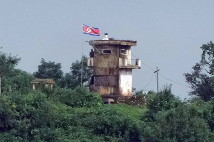 A North Korean soldier stands at the North’s military guard post as a North Korean flag flutters in the wind, in this view from Paju, South Korea, Wednesday, July 24, 2024. North Korea flew more balloons likely carrying trash toward South Korea on Wednesday, Seoul officials said, days after South Korea boosted its frontline broadcasts of K-pop songs and propaganda messages across the rivals’ heavily armed border. AP/RSS Photo