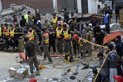 Security officials and rescue workers gather at the site of suicide bombing, in Peshawar, Pakistan, Monday, Jan. 30, 2023. AP/RSS Photo