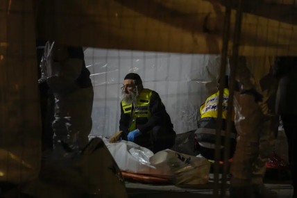 Members of Zaka Rescue and Recovery team check victims of a shooting attack near a synagogue in Jerusalem, Friday, Jan. 27, 2023. AP/RSS Photo