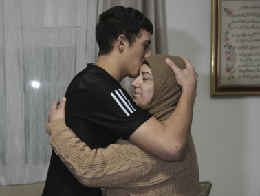 Released Palestinian prisoner Muhammad Abu Al-Humus, 17, hugs his mother after arriving home in the east Jerusalem neighborhood of Issawiya, Tuesday Nov. 28, 2023. AP/RSS Photo
