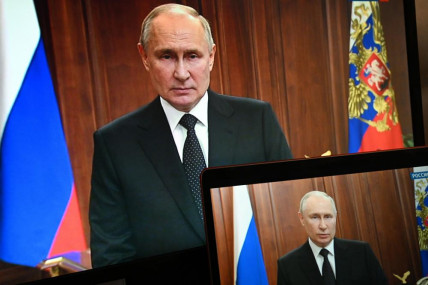 FILE - Russian President Vladimir Putin is seen on monitors as he addresses the nation after Yevgeny Prigozhin, the owner of the Wagner Group military company, called for armed rebellion and reached the southern city of Rostov-on-Don with his troops, in Moscow, Russia, Saturday, June 24, 2023. AP/RSS Photo
