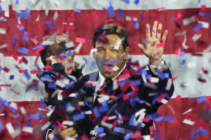 Incumbent Florida Republican Gov. Ron DeSantis holds his son Mason as he celebrates winning reelection, at an election night party in Tampa, Florida, Tuesday, Nov. 8, 2022. AP/RSS Photo