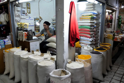 A vendor waits for customers at his stall that sells rice and other grains at a market in Jakarta, Indonesia, Sunday, Aug. 14, 2022. AP/RSS Photo