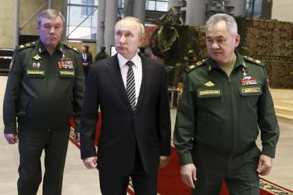 FILE - Russian President Vladimir Putin, center, escorted by Russian Defense Minister Sergei Shoigu, right, and General Staff Valery Gerasimov walk after attending an extended meeting of the Russian Defense Ministry Board at the National Defense Control Center in Moscow, Russia, Tuesday, Dec. 21, 2021. AP/RSS Photo
