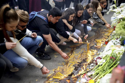 School children light candles near the Vladislav Ribnikar school in Belgrade, Serbia, Thursday, May 4, 2023. Many wearing black and carrying flowers, scores of Serbian students on Thursday paid silent homage to their peers killed a day earlier when a 13-year-old boy used his father’s guns in a school shooting rampage that sent shock waves through the nation and triggered moves to boost gun control. AP/RSS Photo
