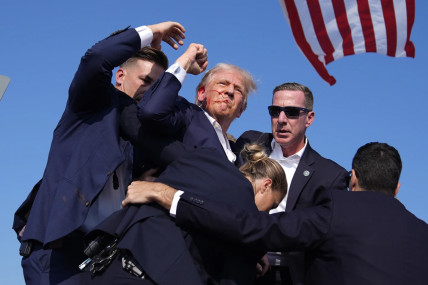 Republican presidential candidate former President Donald Trump is helped off the stage at a campaign event in Butler, Pa., on Saturday, July 13, 2024. AP/RSS Photo