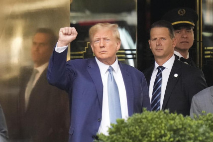 Former US President Donald Trump, left, gestures as he leaves Trump Tower in New York, Thursday, April 13, 2023. AP/RSS Photo