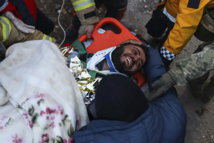 Turkish rescue workers carry Ergin Guzeloglan, 36, to an ambulance after pulled him out from a collapsed building five days after an earthquake in Hatay, southern Turkey, early Saturday, Feb. 11, 2023. AP/RSS Photo