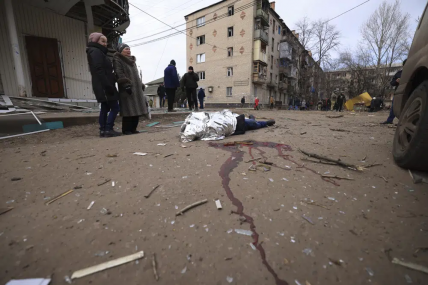 Nina Kovalenko, 66, cries over the body of her son Mykhailo Kovalenko, 34, who was killed by a Russian attack in Kostiantynivka, Ukraine, Saturday, Jan. 28, 2023. AP/RSS Photo