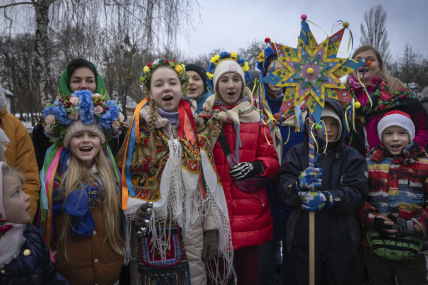 Children dressed in national suits sings carol as they celebrate Christmas in the village of Pirogovo outside capital Kyiv, Ukraine, Monday, Dec. 25, 2023.  AP/RSS Photo