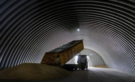 FILE - A dump track unloads grain in a granary in the village of Zghurivka, Ukraine, Aug. 9, 2022. AP/RSS Photo