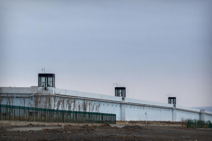 FILE - Guard towers stand on the perimeter wall of the Urumqi No. 3 Detention Center in Dabancheng in western China's Xinjiang Uyghur Autonomous Region on April 23, 2021.  AP/RSS Photo