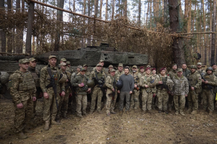In this photo provided by the Ukrainian Presidential Press Office, Ukrainian President Volodymyr Zelenskyy, center, poses for photo with the Ukrainian soldiers in front of a Leopard 2 tank on the front line in the Kharkiv region, Ukraine, Tuesday, Oct. 3, 2023. AP/RSS Photo