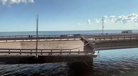 A still from a video released by a Crimean news station showing a damaged section of the Kerch Strait Bridge on Monday.
