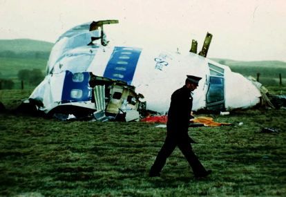 FILE - A police officer walks by the nose of Pan Am flight 103 in a field near the town of Lockerbie, Scotland where it lay after a bomb aboard exploded, killing a total of 270 people, Wednesday, Dec. 21, 1988.  AP/RSS Photo