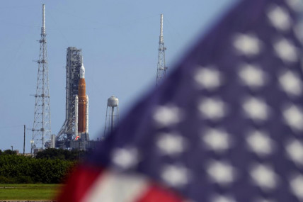 An American flag flies in the breeze as NASA's new moon rocket sits on Launch Pad 39-B after being scrubbed at the Kennedy Space Center Saturday, Sept. 3, 2022, in Cape Canaveral, Florida. AP/RSS Photo