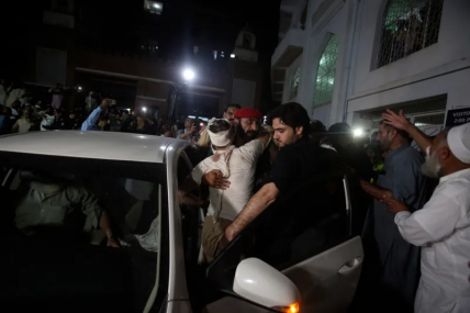 An injured victim embraces his relative upon arrival at a hospital in Peshawar, Pakistan, Sunday, July 30, 2023.  AP/RSS Photo