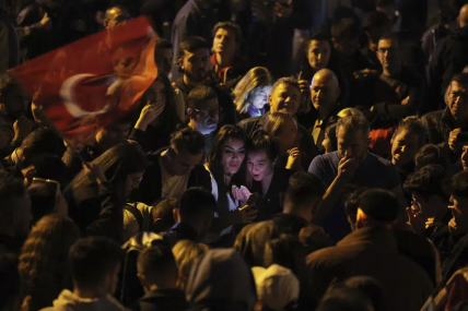 Supporters of Republican People's Party use their cellphones to watch the election results outside the headquarters of CHP, in Ankara, Turkey, Sunday, May 14, 2023.  AP/RSS Photo