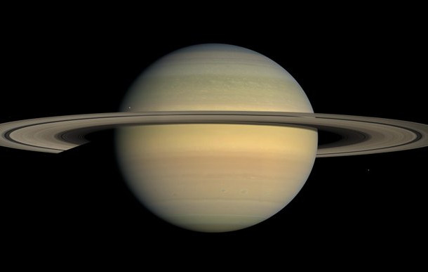 This July 23, 2008 file image made available by NASA shows the planet Saturn, as seen from the Cassini spacecraft. Twenty new moons have been found around Saturn, giving the ringed planet a t