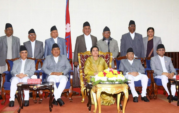 The newly appointed provincial chiefs (standing) pose for photographs with President Bidya Devi Bhandari (sitting at center), PM KP Sharma Oli (on her right) and others.