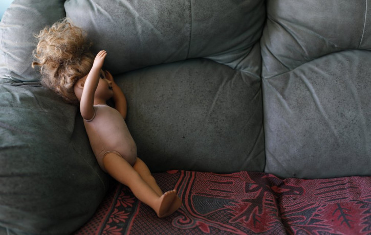 This Aug. 23, 2019, photo shows a doll on a couch at the Comayagua, Honduran home of a 3-year-old who was separated from her father when they tried to seek asylum at the U.S. southern border.