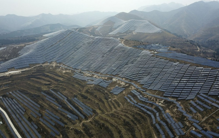 In this Nov. 27, 2019, photo, a solar panel installation is seen in Ruicheng County in central China's Shanxi Province.