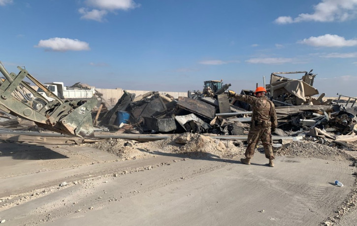 U.S. soldiers clear rubble from a site of Iranian bombing at Ain al-Asad air base in Anbar, Iraq, Monday, Jan. 13, 2020.