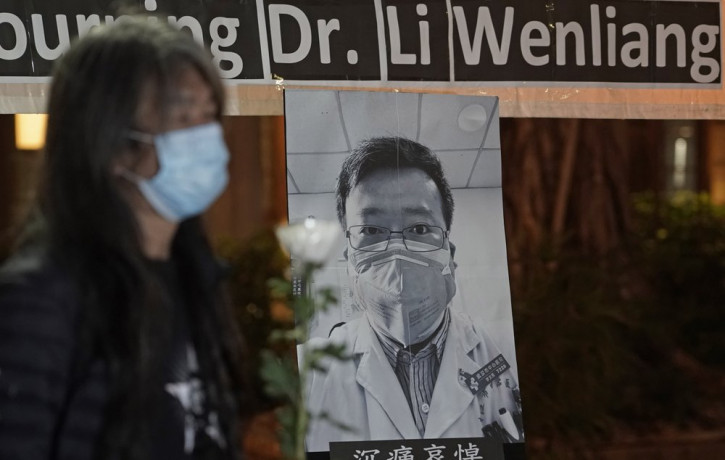 Pro-democracy activist Leung Kwok-hung, wearing a mask, attends a vigil for Chinese doctor Li Wenliang, in Hong Kong, Friday, Feb. 7, 2020.