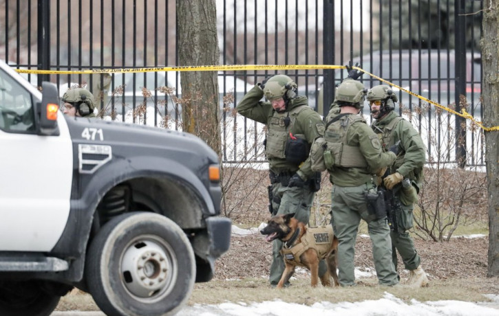 Police work outside the Molson Coors Brewing Co. campus in Milwaukee on Wednesday, Feb. 26, 2020, after reports of a possible shooting.