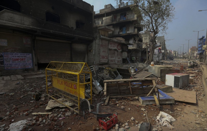 A view of burnt buildings and vandalized street in Tuesday's violence in New Delhi, India, Wednesday, Feb. 26, 2020.