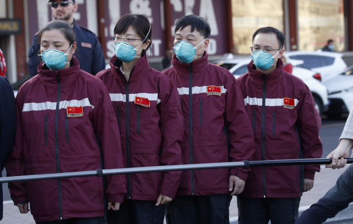 Medics and paramedics from China arrive at the Malpensa airport of Milan, Wednesday, March 18, 2020.