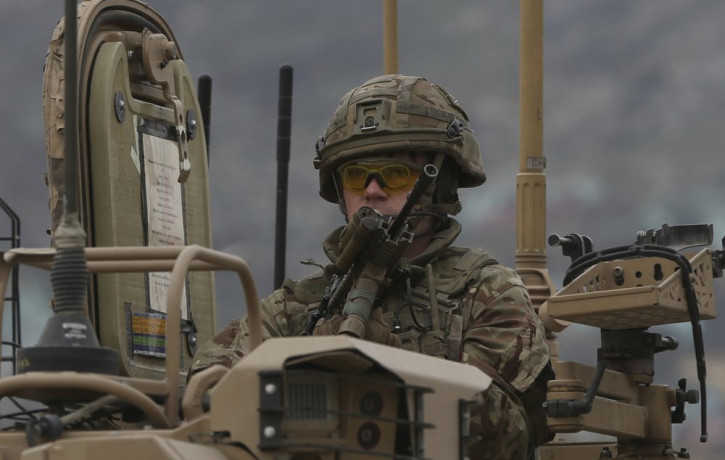 A British soldier with NATO-led Resolute Support Mission forces arrives at the site of an attack in Kabul, Afghanistan, Wednesday, March 25, 2020.