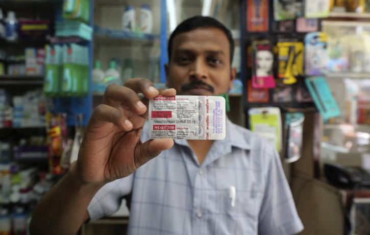 A chemist displays hydroxychloroquine tablets in Mumbai, India, Tuesday, May 19, 2020. President Donald Trump’s declaration that he was taking the antimalarial drug of dubious effectiveness t