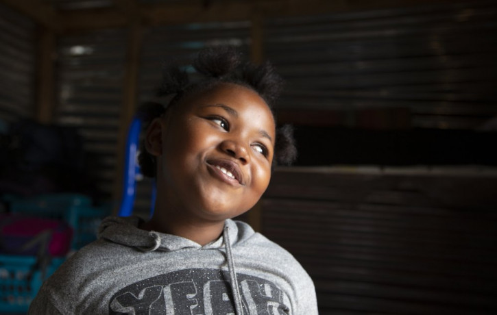 Lilitha Jiphethu, 11, sings in her first language, Xhosa, inside her home in Orange Farm, South Africa, on Tuesday, April 28, 2020. “I have a friend in Jesus. He is loving and he’s not like a