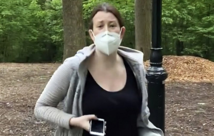 This file image made from May 25, 2020 video provided by Christian Cooper, shows Amy Cooper with her dog talking to Christian Cooper in Central Park in New York.