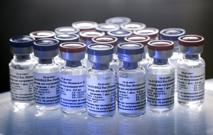 In this handout photo taken on Thursday, Aug. 6, 2020, and provided by Russian Direct Investment Fund, a new vaccine is on display at the Nikolai Gamaleya National Center of Epidemiology and 